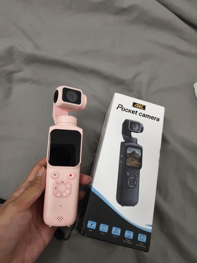 VETEK 4K Pocket Camera Pink Gimbal Camera (Category: Cameras) located in Angeles City. Submitted by measaliman02351 (Listing ID 1465421194, Image 1). Description: - Color: Cute Pink - Video Quality: 4K recording - Connectivity: WiFi enabled - Features: Auto face tracking & 330-degree rotation - Display: Screen turns on with VETEK logo - Design: Compact handheld stabilizer - Inclusions: Comes with original box.
