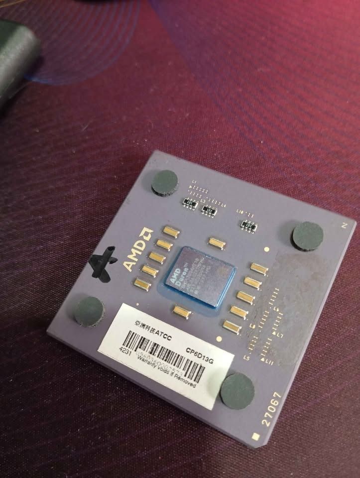 VINTAGE AMD Duron 1200MHz Processor DHD1200AMT1B (Category: Computer Parts) located in Caloocan City. Submitted by caloyzkie20 (Listing ID 1465393191, Image 2). Description: - Model: AMD Duron 1200MHz (DHD1200AMT1B) - Socket Type: Socket A with gold pins - Features integrated heatspreader - Condition: Pulled from a working system, tested and stored safely - Ideal for retro PC builds and hardware collections.