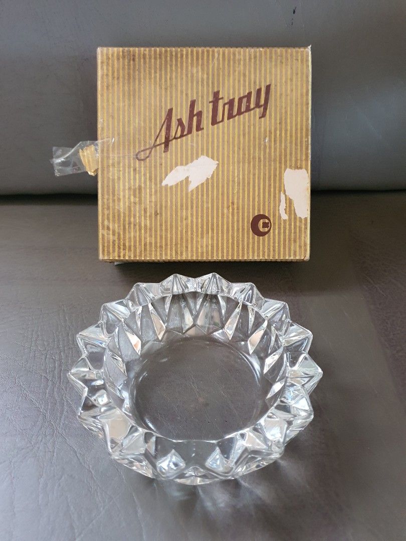 Vintage Crystal Ashtray with Original Box (Category: Vintage Collectibles) located in Catbalogan. Submitted by jncetpangz (Listing ID 1465573881, Image 1). Description: - Heavy crystal ashtray with a stunning star-burst faceted design - Chunky, durable glass perfect for daily use - Medium size - Includes original striped cardboard box (shows minor surface wear) - From a clean, smoke-free home.