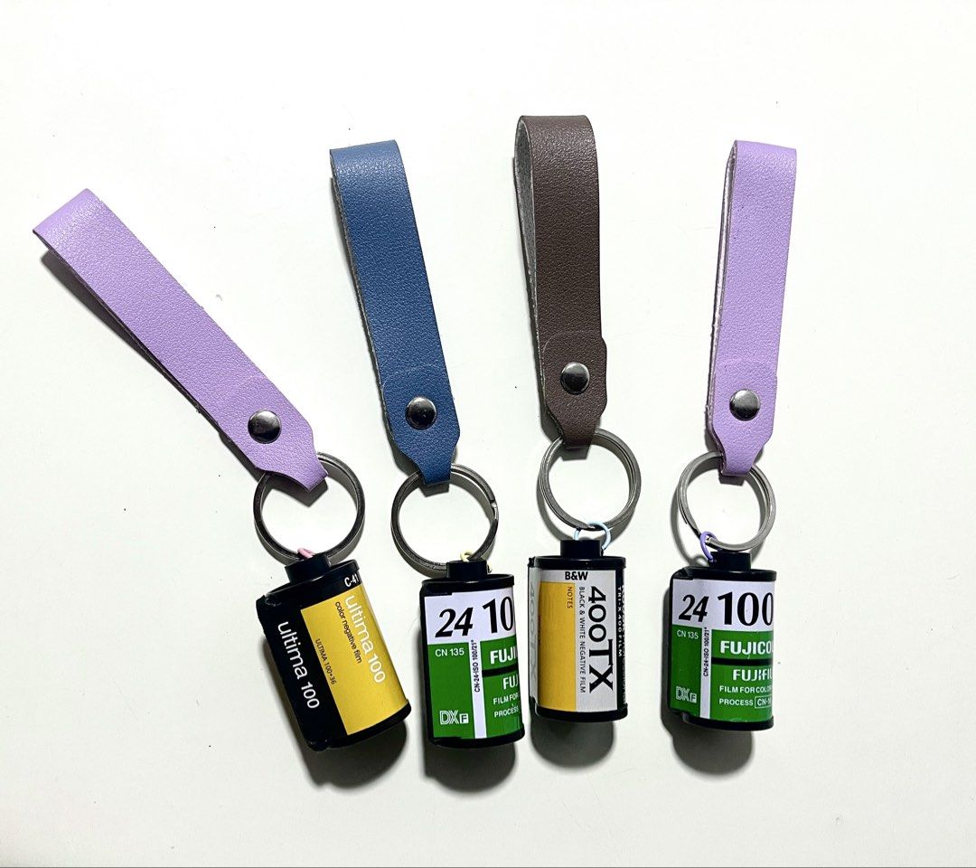 Vintage Film Roll Leather Strap Keychain Set (Category: Handmade Craft) located in Paranaque City. Submitted by smconsul (Listing ID 1465525341, Image 1). Description: - handmade keychains featuring authentic recycled film canisters - Equipped with sturdy leather loop straps in pastel purple, blue, brown, and lavender - Includes durable metal split rings for your keys - Clean condition and well-crafted - Perfect gift for photography enthusiasts a
