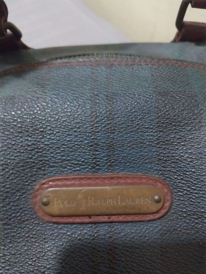 Vintage Ralph Lauren doctors bag (Category: Luxury Bags & Wallets) located in Manila. Submitted by PrinceDani.Clothing (Listing ID 1465485421, Image 3). Description: - Authentic vintage Polo Ralph Lauren Boston bag - Iconic Black Watch tartan plaid pattern in dark green and navy blue - Genuine brown leather handles and trim - Durable textured vinyl body with brass-toned hardware and front branding plate - Secure top zip closure with comfortable d
