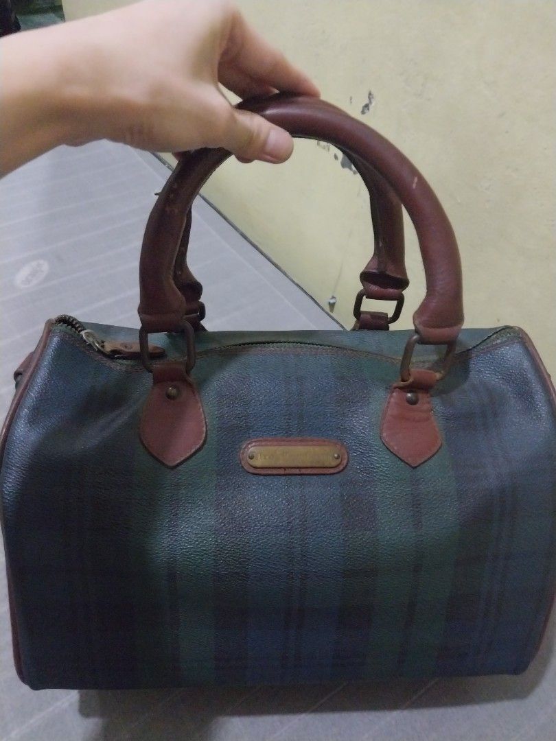 Vintage Ralph Lauren doctors bag (Category: Luxury Bags & Wallets) located in Manila. Submitted by PrinceDani.Clothing (Listing ID 1465485421, Image 1). Description: - Authentic vintage Polo Ralph Lauren Boston bag - Iconic Black Watch tartan plaid pattern in dark green and navy blue - Genuine brown leather handles and trim - Durable textured vinyl body with brass-toned hardware and front branding plate - Secure top zip closure with comfortable d