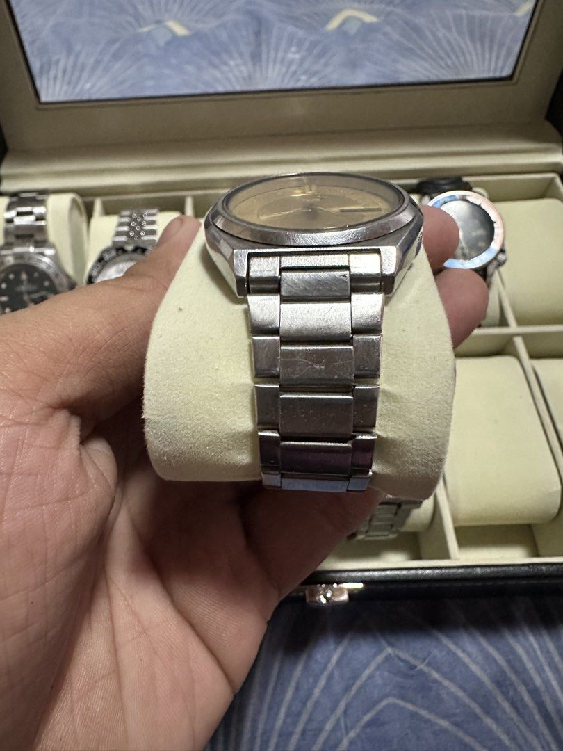 Vintage Seiko 5 Automatic Gold Dial Watch (Category: Men's Watches) located in Manila. Submitted by zealdeer_4239a8 (Listing ID 1465546069, Image 2). Description: - Model: Vintage Seiko 5 Automatic Watch - Dial: Classic gold dial with day and date display at the 3 o'clock position - Materials: Stainless steel case and bracelet with a signed Seiko clasp - Movement: Automatic (keeps ticking reliably) - Condition: Noticeable scratches on the crystal