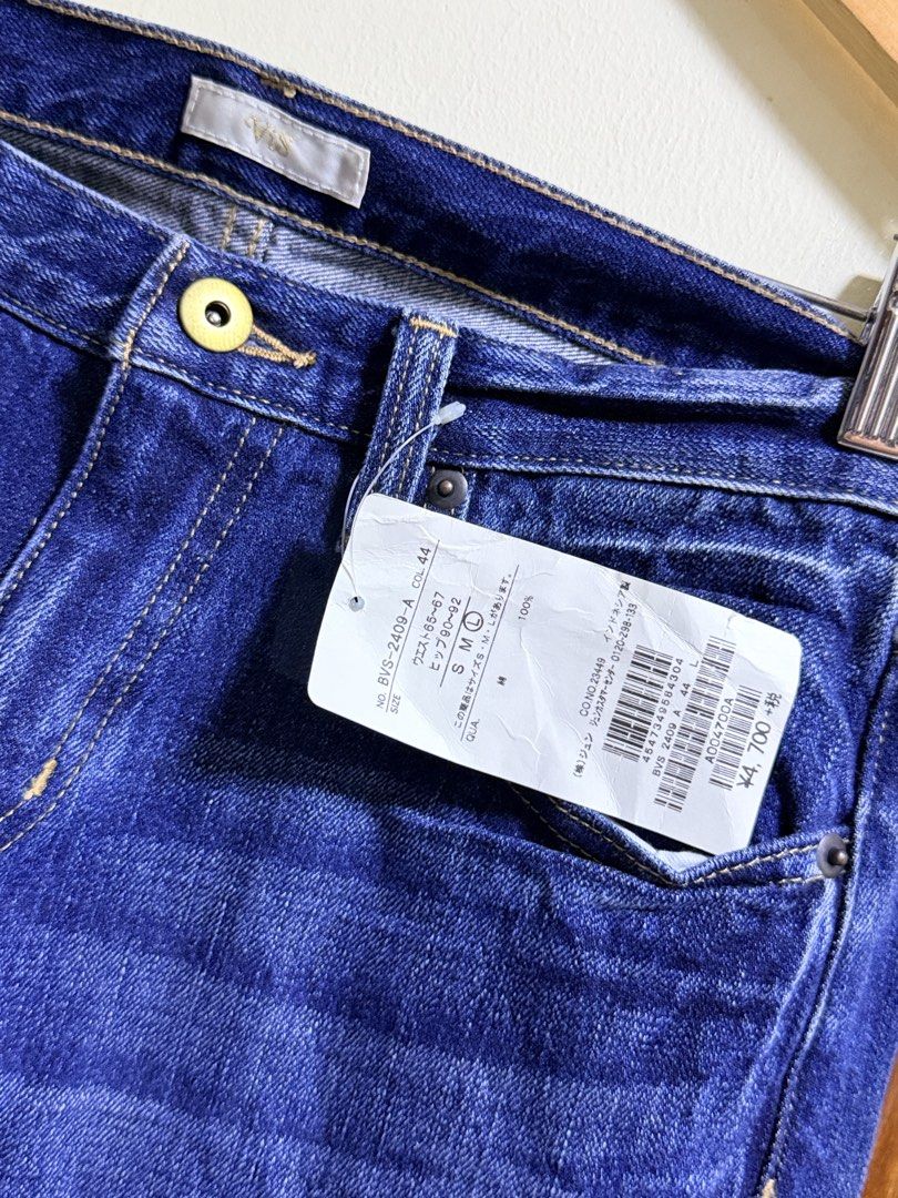ViS Blue Denim Jeans with Tags Size L (Category: Jeans) located in Paete. Submitted by skydruemadison (Listing ID 1465508466, Image 2). Description: - Brand: ViS - Condition: Brand new with original store tags attached - Color: Dark blue with classic whiskering and fading details - Fit/Cut: Straight-leg - Size: L (with waist measurements on tag) - Material: 100% cotton - Features: Contrast yellow stitching, belt loops, button closure, and standar