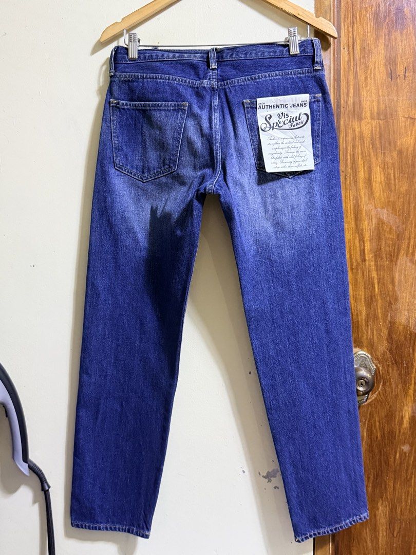 ViS Blue Denim Jeans with Tags Size L (Category: Jeans) located in Paete. Submitted by skydruemadison (Listing ID 1465508466, Image 3). Description: - Brand: ViS - Condition: Brand new with original store tags attached - Color: Dark blue with classic whiskering and fading details - Fit/Cut: Straight-leg - Size: L (with waist measurements on tag) - Material: 100% cotton - Features: Contrast yellow stitching, belt loops, button closure, and standar