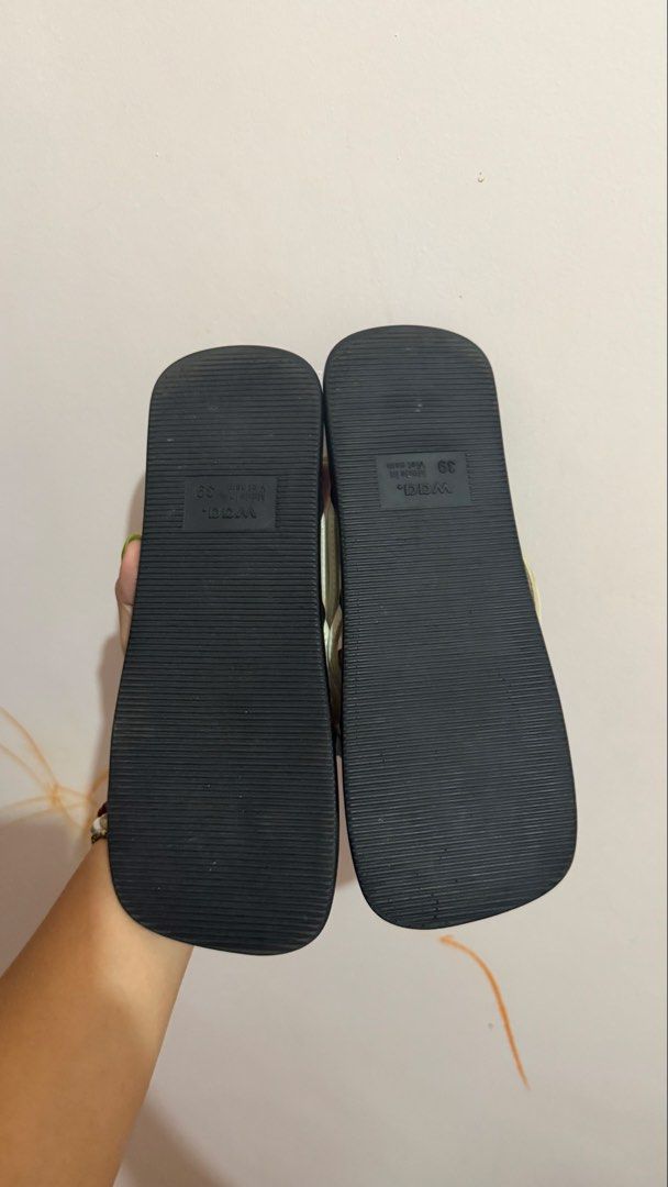 Waa. Tangled Sandals (Category: Flats & Sandals) located in Limay. Submitted by nimfalorraine (Listing ID 1465396378, Image 3). Description: - Brand: Waa. - Size: 39 (Made in Vietnam) - Color: Classic Black & White - Style: Minimalist slip-on thong sandals with white tubular straps and trendy knot details - Sole: Flat with textured rubber bottom for anti-slip grip - Condition: Good, with minor wear on the white strap material near the knots.