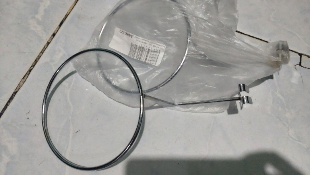 Wall mount helmet cap holder 2pcs. (Category: Hooks & Hangers) located in Valenzuela. Submitted by diane.35 (Listing ID 1465500083, Image 1). Description: - Chrome-finished steel wall rack - Ideal for motorcycle helmets, hats, or wigs - Keeps gear organized and off tables - Sturdy metal ring design - Features two screw holes for secure wall mounting - Comes in clear protective packaging.