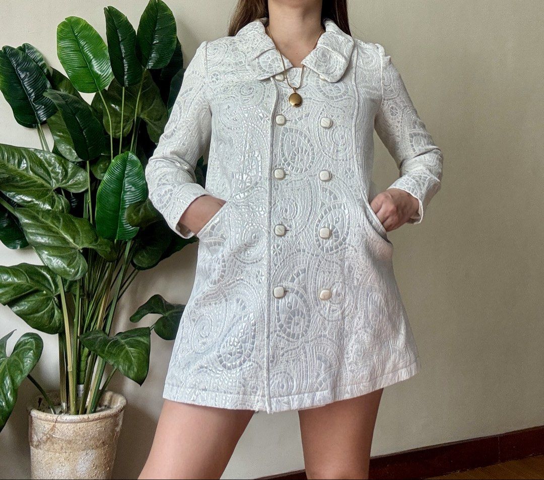 WANKO White Brocade Pattern Double Breasted Coat Jacket,s to m (Category: Coats, Jackets and Outerwear) located in Mandaluyong City. Submitted by roxieeeeeee (Listing ID 1465405756, Image 1). Description: - Color: White - Design: Intricate textured pattern all over with a structured fit - Closure: Double-breasted front with square white buttons - Details: Wide rounded collar and deep front pockets on both sides - Sleeves: Long sleeves - Style: Ve