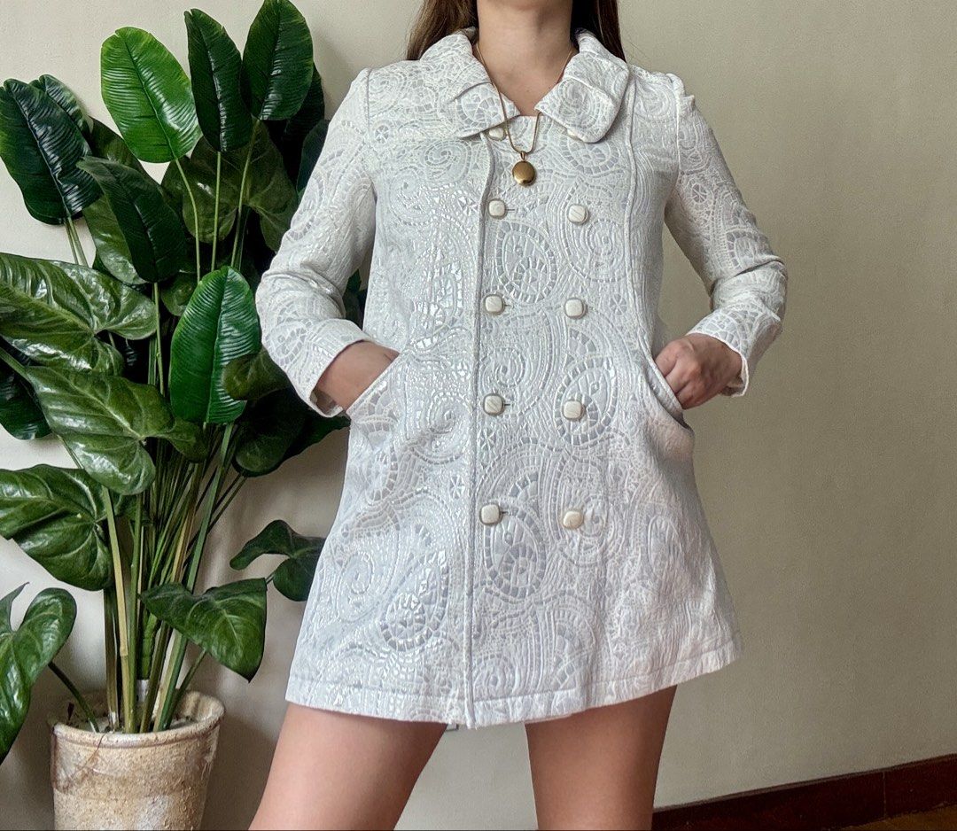 WANKO White Brocade Pattern Double Breasted Coat Jacket,s to m (Category: Coats, Jackets and Outerwear) located in Mandaluyong City. Submitted by roxieeeeeee (Listing ID 1465405756, Image 3). Description: - Color: White - Design: Intricate textured pattern all over with a structured fit - Closure: Double-breasted front with square white buttons - Details: Wide rounded collar and deep front pockets on both sides - Sleeves: Long sleeves - Style: Ve