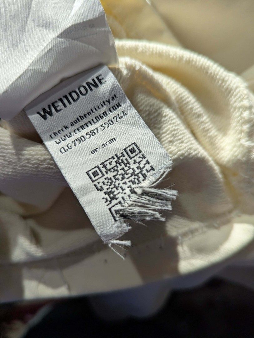 We11done Multi Logo Long Sleeve Sweatshirt Off-White Size M (Category: Coats, Jackets and Outerwear) located in Manila. Submitted by grandwater.53a8ce (Listing ID 1465489415, Image 3). Description: - Brand: We11done - Color: Cream / Off-white - Size: Medium (M) - Material: 100% Cotton shell - Design: Colorful stacked typography prints on the front, with ribbed collar, cuffs, and hem - Authenticity: Includes Certilogo tag.