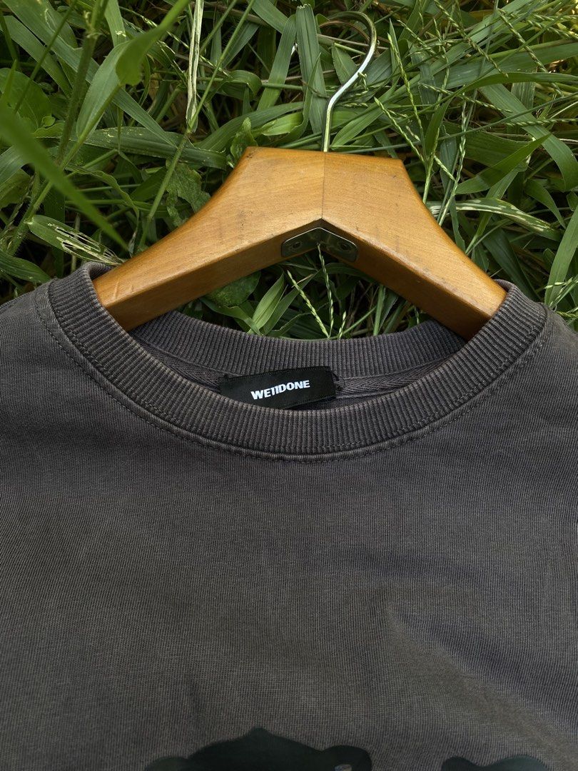 Weldone Acidwash (Category: Tshirts & Polo Shirts ) located in Jaen. Submitted by oshimamark58418 (Listing ID 1465476736, Image 3). Description: - Brand: We11done legit - Color: Dark grey acid wash - Size: XS (Oversized fit, fits like XL) Dines 24x31 - Material: 100% Cotton (Made in Korea) - Design: Front bear graphic with reflective logo details and back zipper graphic - Condition: Excellent pre-loved condition - Perfect for streetwear and casua