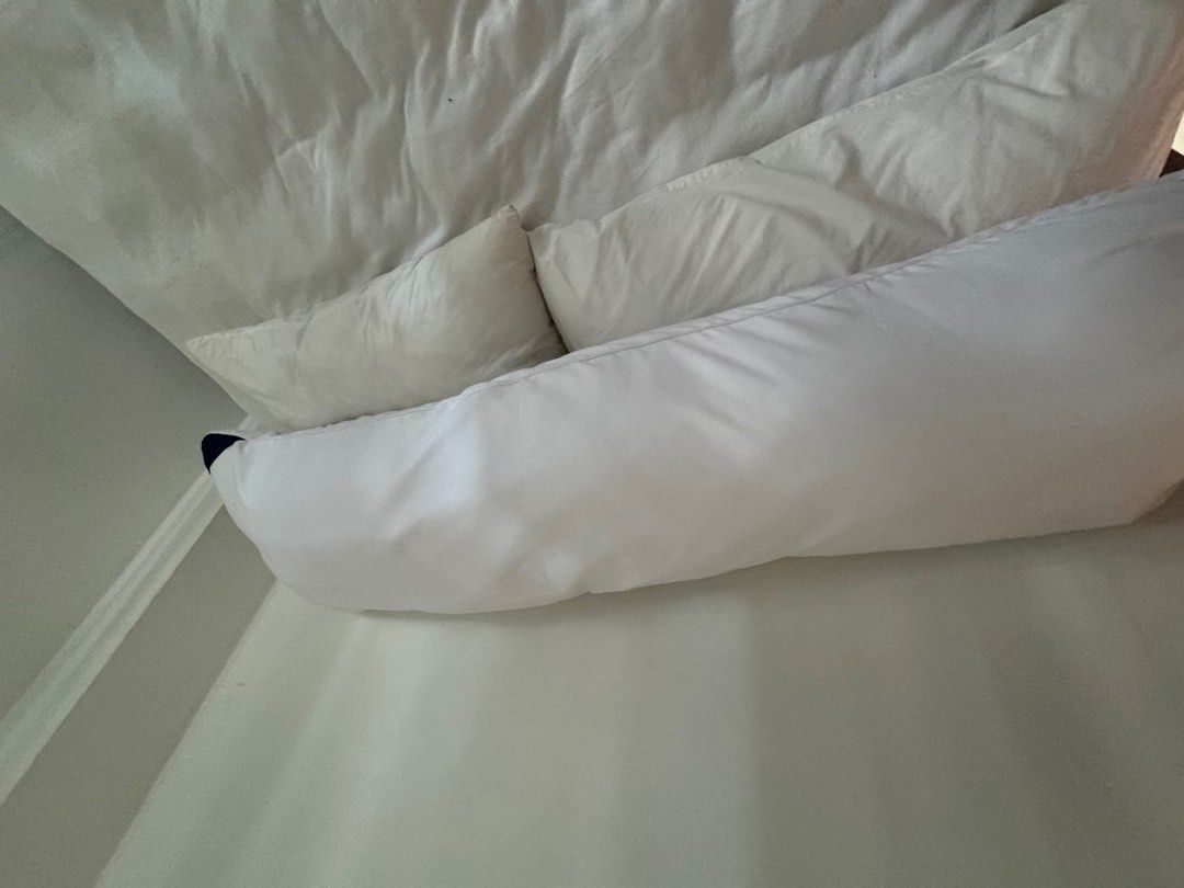 White long body pillow (Category: Bedding & Towels) located in Manila. Submitted by decluterthings888 (Listing ID 1465487676, Image 1). Description: .