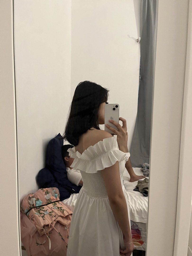 White off-shoulder ruffled midi dress (Category: Dresses) located in Cavite. Submitted by bihnibini (Listing ID 1465578369, Image 2). Description: -attended a wedding using this dress - Style: White off-shoulder midi dress with ruffled front detailing - Fit: Stretchy smocked back panel for comfort, flare skirt below the knee - Fabric: Lightweight and breathable - Occasion: Great for casual days out or weekend events -.