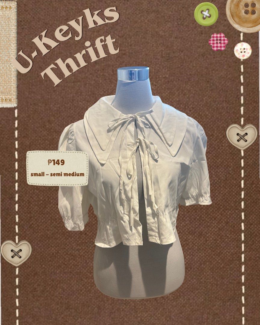 White Peter Pan Collar Crop Blouse With Tie Strings (Category: Blouses) located in Cavite. Submitted by ukeyks (Listing ID 1465490111, Image 1). Description: - Color: Clean white - Fit: Best for small to semi-medium frames - Design: Oversized Peter Pan collar with double front ribbon ties - Details: Gathered puff sleeves and playful ruffled hem .