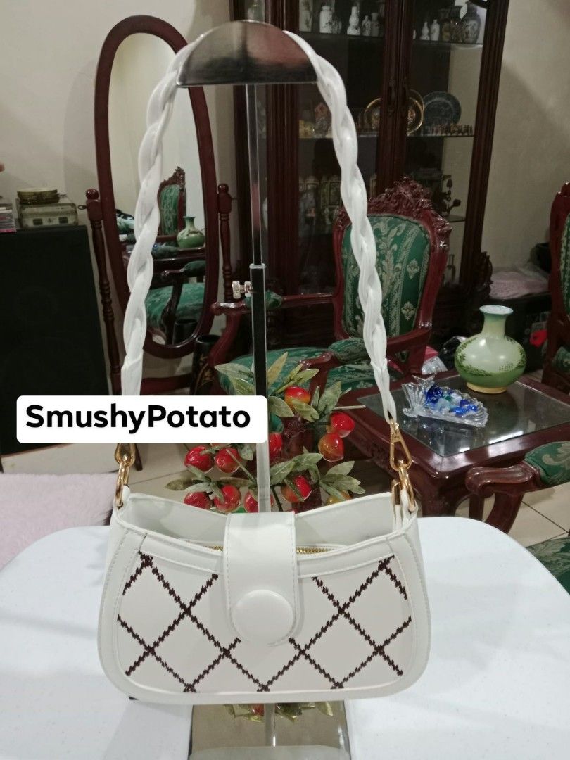 white shoulder bag features a distinctive braided handle and a charming diamond-stitched lattice pattern (Category: Shoulder Bags) located in Antipolo. Submitted by smushypotatoo (Listing ID 1465503920, Image 1). Description: .