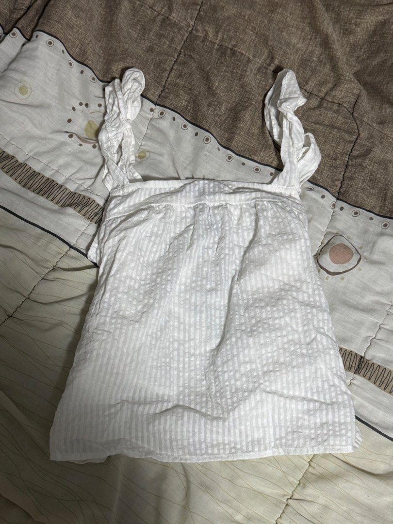 H&M White Summer Seersucker Ruffle Strap Cami Top (Category: Others Tops) located in Manila. Submitted by glossywife (Listing ID 1465475709, Image 1). Description: Size small Perf for summer! Bnew w no tags Never been tried on or worn out Rfs: Decluttering Mop: GCash / Bank Transfer Mod: GrabExpress / J&T / Lalamove Brandy Melville Zara Isa the label H&M Cotton On Stradivarius Phia Hollister Subdued John Galt Miu the label Traje Linen Bershka Ari