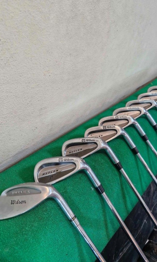 Wilson Reflex Full Golf Irons Set (Category: Golf) located in Quezon City. Submitted by gidsfinds (Listing ID 1465524583, Image 1). Description: Wilson Reflex Golf Irons Full Set 3 - SW *Features Wilson's 'Shock Trap' works like a speed pocket. - Original Wilson Grips - True Temper Steel Shafts Regular-Stiff - Good face condition, white markings on the grooves, easily removable, and grooves are still deep and good. Free Shipping within Metro Mani