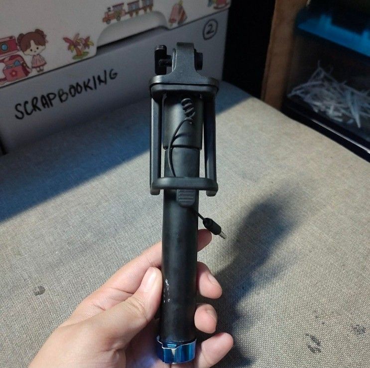 Wired Selfie Stick Monopod with 3.5mm Jack (Category: Tripods & Monopods) located in Quezon City. Submitted by dncpreloved (Listing ID 1465490499, Image 3). Description: - Color: Black - Type: Handheld selfie stick monopod with foldable phone cradle - Portability: Compact and lightweight, fits easily into bags not sure if working pa ung remote. no way to test..