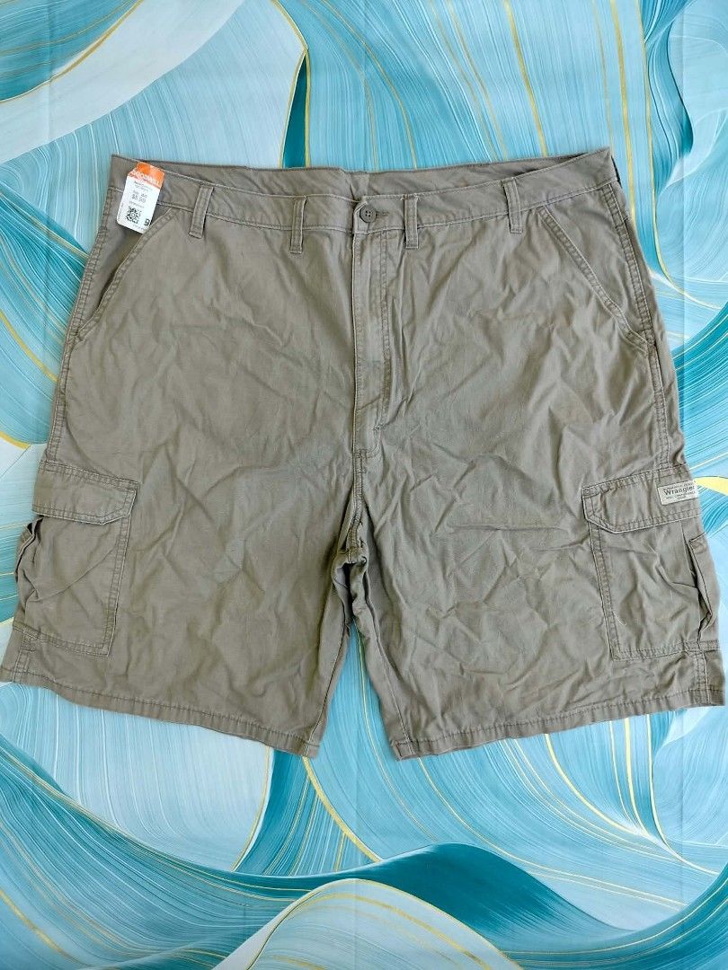 Wrangler Khaki Cargo Shorts Size 44 (Category: Shorts) located in Manila. Submitted by virgiliosa38485 (Listing ID 1465504342, Image 1). Description: - Brand: Wrangler - Size: 44 -Length 24 - Material: 100% breathable cotton - Color: Classic Khaki - Features: Multiple side and back cargo pockets, secure button closure with zipper fly - Condition: Good, perfect for daily casual wear - Fast shipping available across PH!.