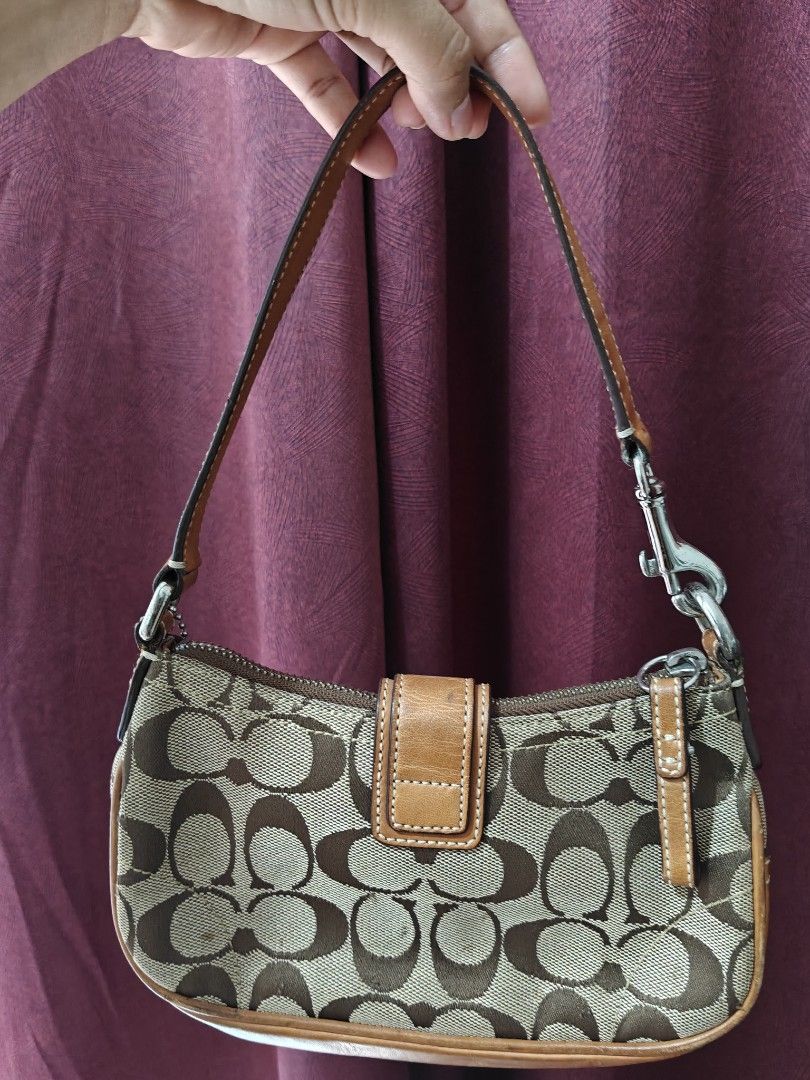 Y2K 2003 COACH BAG (Category: Shoulder Bags) located in Manila. Submitted by nabongggg (Listing ID 1465442239, Image 2). Description: Brand: Coach Line/style: Soho / Signature collection Era: Y2K / early 2000s Production: 2003 Pattern: Signature “C” jacquard Hardware: Silver-tone buckle Colorway: Khaki/tan with brown leather.