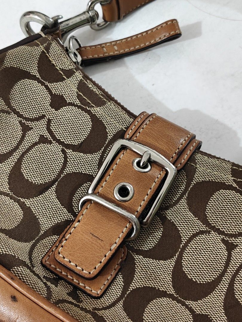 Y2K 2003 COACH BAG (Category: Shoulder Bags) located in Manila. Submitted by nabongggg (Listing ID 1465442239, Image 3). Description: Brand: Coach Line/style: Soho / Signature collection Era: Y2K / early 2000s Production: 2003 Pattern: Signature “C” jacquard Hardware: Silver-tone buckle Colorway: Khaki/tan with brown leather.