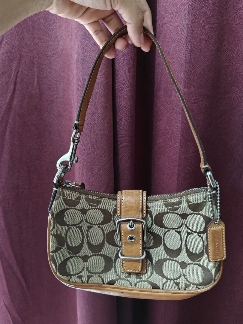 Y2K 2003 COACH BAG (Category: Shoulder Bags) located in Manila. Submitted by nabongggg (Listing ID 1465442239, Image 1). Description: Brand: Coach Line/style: Soho / Signature collection Era: Y2K / early 2000s Production: 2003 Pattern: Signature “C” jacquard Hardware: Silver-tone buckle Colorway: Khaki/tan with brown leather.