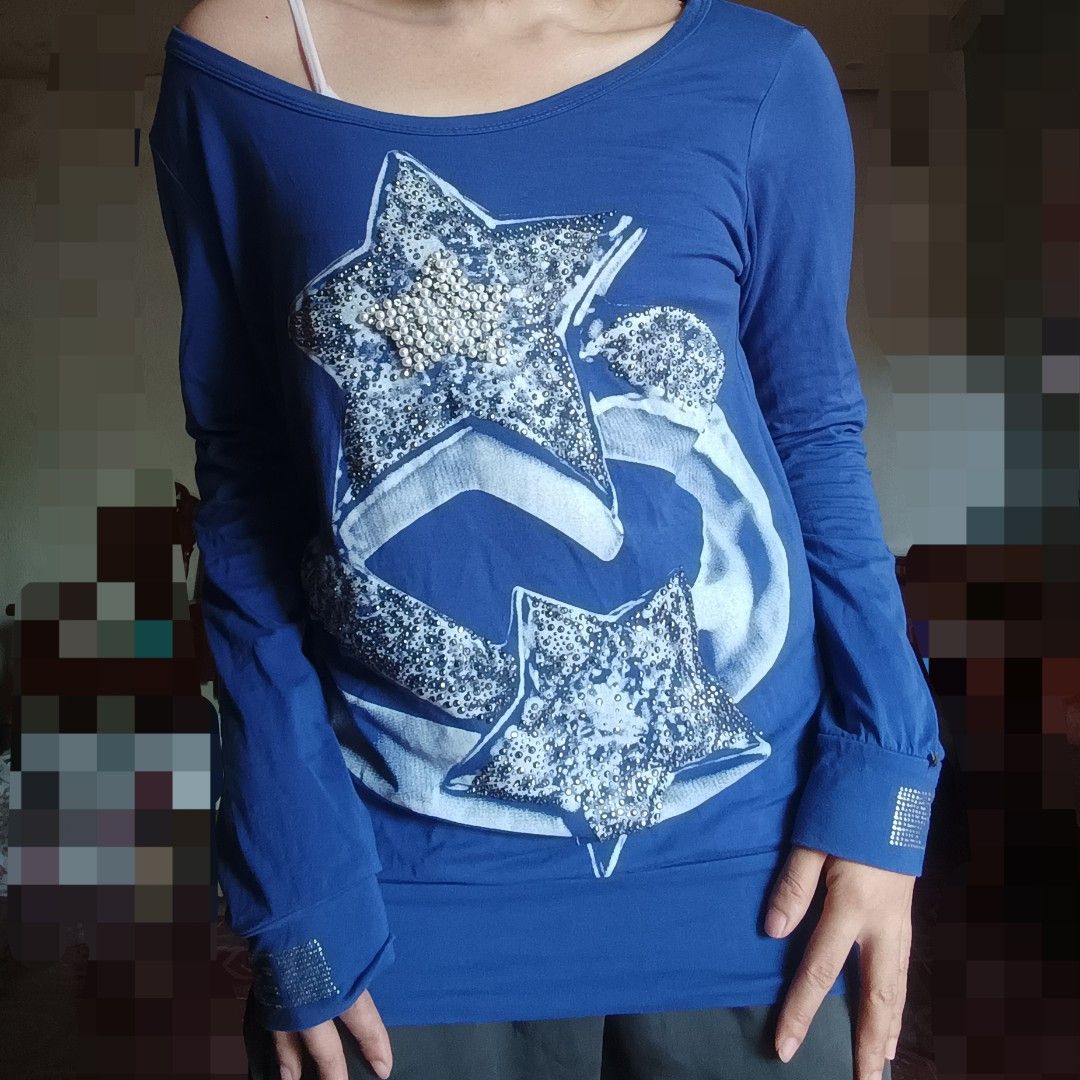Y2K royal blue star sequin graphic top (Category: Longsleeves) located in Adams. Submitted by luckygirl.closet (Listing ID 1464916273, Image 3). Description: s-m can pass as brand new has sequin detail on lower arm part can be worn as off shoulder (see last pic).
