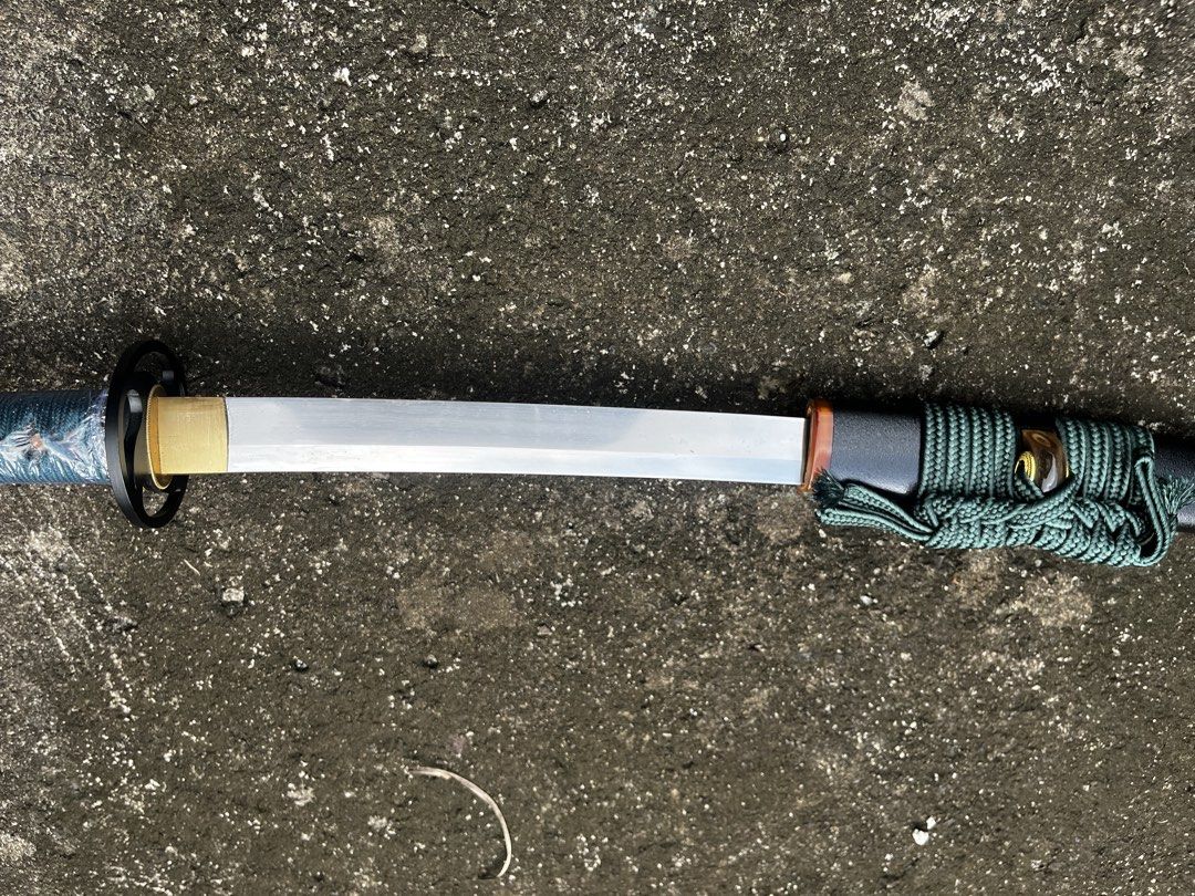 Yottsudomoe Katana (Category: Knives & Chopping Boards) located in Manila. Submitted by happyforest.16c523 (Listing ID 1465490139, Image 3). Description: Yottsudomoe Katana - 1095 Through-Tempered Katana Brand: Iron Tiger Forge Culture: Japanese Pommel: N/A Overall Length: 39 3/4” Blade Length: 28 3/4” Blade: 1095 High Carbon Steel Weight: 2 lbs 7 oxz Edge: Very Sharp P.O.B.: 6 1/8” Thickness: 7.5 mm - 6 mm Width: 32 mm Grip Length: 9 3/4” Class: