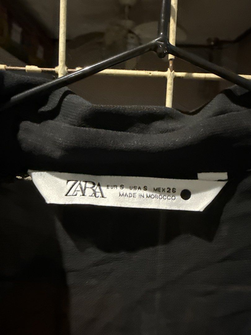 Zara Black Button-Up Long Sleeve Blouse Size S (Category: Longsleeves) located in Quezon City. Submitted by nsseller (Listing ID 1465507158, Image 2). Description: Zara black long sleeve button-up shirt. Collared neckline with front button closure. Two textured front chest pockets and matching textured fabric detail on both shoulders. Lightweight sheer material, made in Morocco. Size EUR S, USA S, MEX 26. Clean condition overall, no obvious flaws