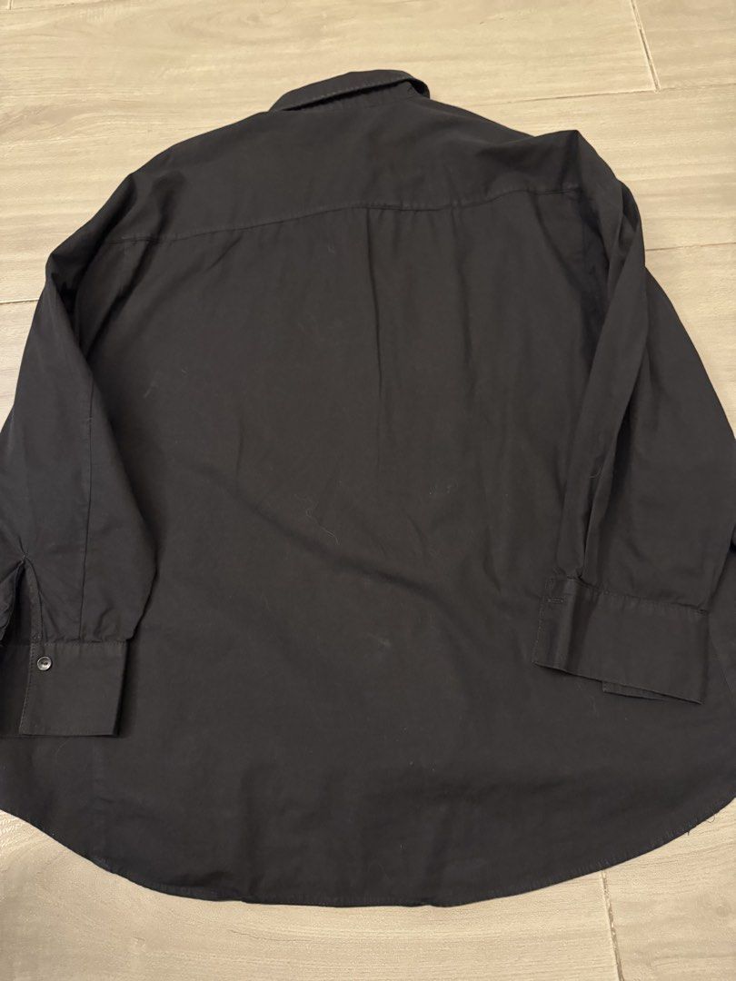 Zara Black Button-Up Shirt With Studded Pockets (Category: Shirts) located in Taguig. Submitted by sqaumejada (Listing ID 1465415889, Image 3). Description: - Brand: Zara - Size: L - Color: Classic Black - Details: Long sleeves with button cuffs, standard collar, and two chest pockets accented with small metal studs - Hem: Curved hemline, slightly longer in the back - Origin: Made in Turkey - Style: Casual with an edgy twist.