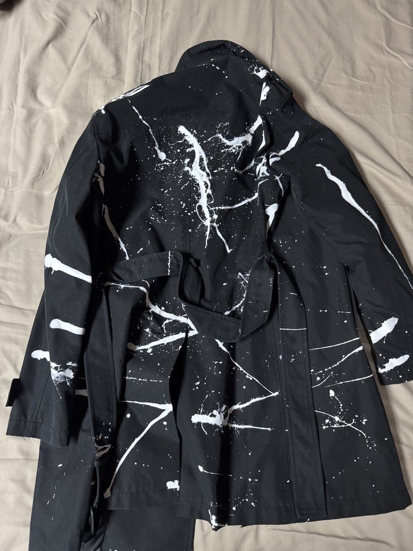 Zara Black White Paint Splatter Trench Coat (Category: Coats, Jackets and Outerwear) located in Manila. Submitted by seangoart (Listing ID 1465517100, Image 2). Description: - Size: L (fits true to standard large) - Color/Design: Black with allover white paint splatter pattern - Closure: Double-breasted button closure with matching fabric waist belt - Interior: Fully lined for comfort - Origin: Made in Indonesia.