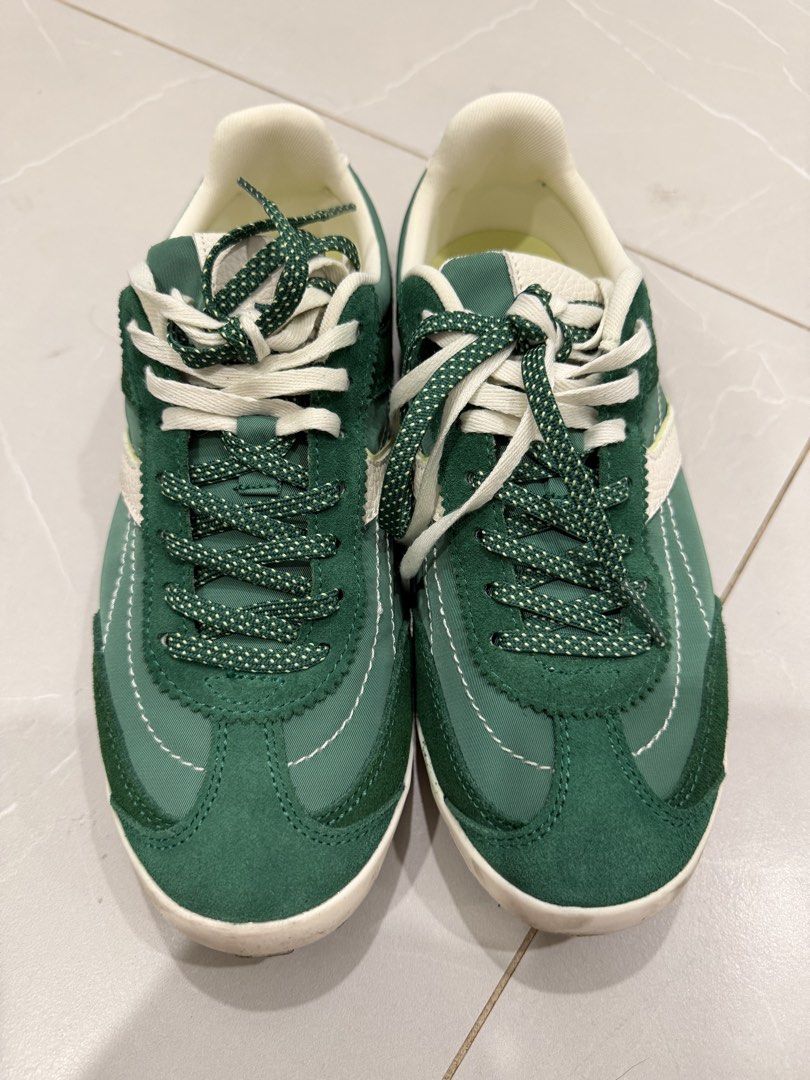 Zara Green Sneakers Size 37 (Category: Sneakers) located in Talisay. Submitted by itslucym (Listing ID 1465418220, Image 1). Description: - Brand/Model: Zara Green Sneakers - Size: EU 37 - Material: Mixed fabric finish with stylish suede overlays - Design: Contrast white stripes on the sides - Laces: Includes both speckled green laces and classic white laces - Soles: White textured outer soles with normal signs of wear underneath - Like new, worn