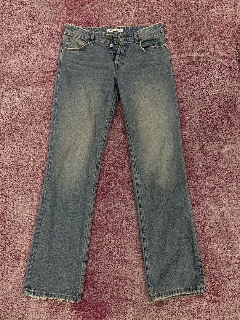 Zara Light Wash Button Fly Distressed Jeans Size 30 (Category: Jeans) located in Las Pinas. Submitted by francesaly (Listing ID 1465463397, Image 1). Description: Zara light wash denim jeans. Straight leg fit with distressed raw edges at the waistband and hems. Button-fly closure with metallic buttons. Five pocket styling with standard back pockets. Size EUR 40, USA 30, MEX 30 on tag. Medium blue tone with subtle fading along the front thighs..