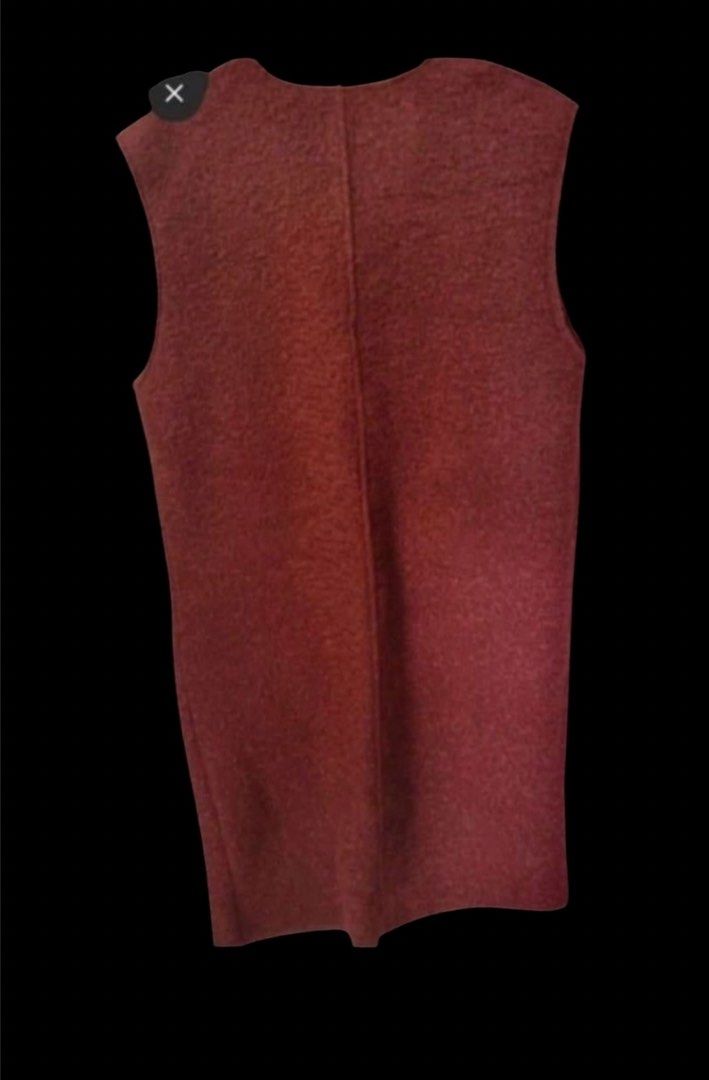 Zara Long Vest for travel (Category: Sleeveless) located in Quezon City. Submitted by kcobs (Listing ID 1465401201, Image 3). Description: - Brand: Zara - Condition: Brand new with original paper tag attached - Color: Rusty Red - Style: Long cut, V-neckline, plain back with center seam detail - Pockets: Two front welt pockets with flaps - Fabric: Textured wool-like material - Perfect for autumn or winter travel - brand new with tag.