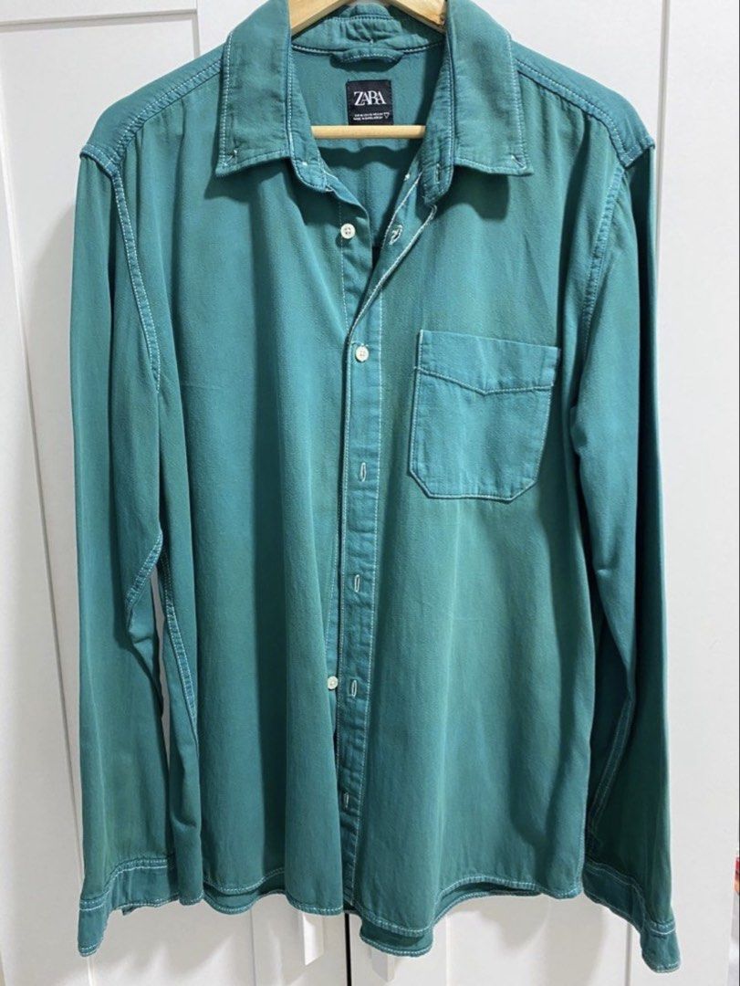 ZARA MAN Teal Overshirt XL (Category: Tshirts & Polo Shirts ) located in Quezon City. Submitted by wearhouze (Listing ID 1465484415, Image 1). Description: - Brand: Zara - Size: XL - Color: Teal with contrast white stitching - Details: Single chest pocket, relaxed fit - Condition: Clean, excellent pre-owned condition.