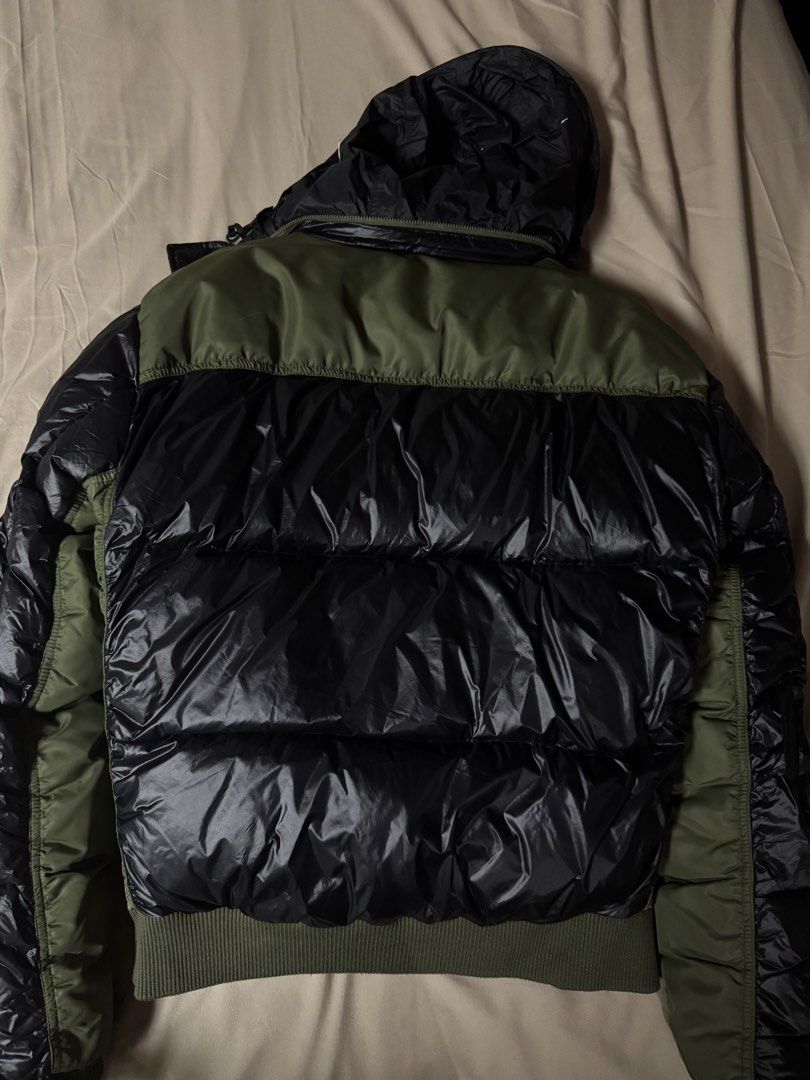 Zara Srpls Down Jacket 03 Nylon Black Olive Green (Category: Coats, Jackets and Outerwear) located in Manila. Submitted by seangoart (Listing ID 1465500446, Image 3). Description: - Brand: Zara SRPLS (DWN/JKT 03) - Color: Glossy black with olive green contrast panels - Features: Hooded design, zip-up front, secure interior pocket, and ribbed knit cuffs - Style: Military surplus aesthetic, trendy winter outerwear - Origin: Made in Indonesia - Cond