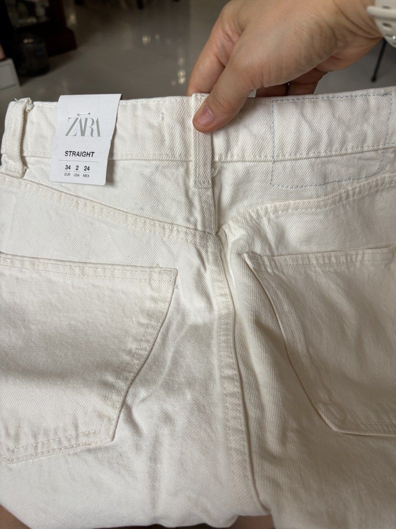 Zara Straight White Jeans Size 34 (Category: Jeans) located in Cagayan de Oro. Submitted by rare.smacky (Listing ID 1465396924, Image 3). Description: - Brand: Zara - Style: High rise straight leg jeans - Color: Off-white - Details: Chic raw frayed hem at the ankles - Condition: Brand new with tags (BNWT), never worn - Size: EUR 34 / USA 2 / MEX 24 - Original price tag included.