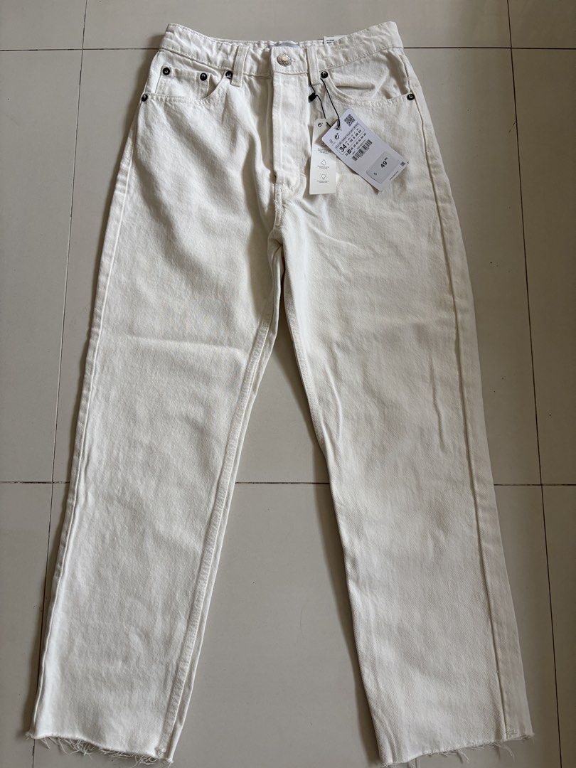 Zara Straight White Jeans Size 34 (Category: Jeans) located in Cagayan de Oro. Submitted by rare.smacky (Listing ID 1465396924, Image 1). Description: - Brand: Zara - Style: High rise straight leg jeans - Color: Off-white - Details: Chic raw frayed hem at the ankles - Condition: Brand new with tags (BNWT), never worn - Size: EUR 34 / USA 2 / MEX 24 - Original price tag included.