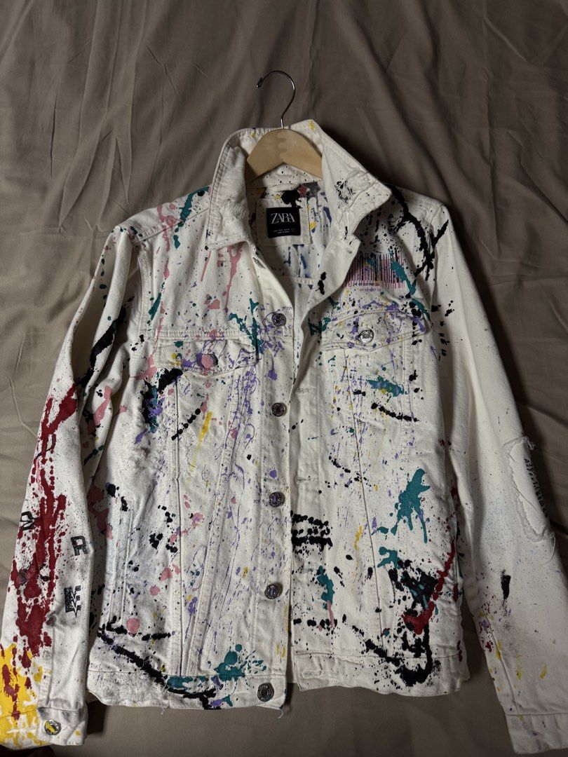 Zara White Paint Splatter Denim Jacket Size L (Category: Coats, Jackets and Outerwear) located in Manila. Submitted by seangoart (Listing ID 1465511366, Image 1). Description: Zara denim jacket in white with multi-color paint splatter design all over. Distressed details on collar, cuffs, and hem. Metal button closure down the front, dual chest pockets with button flaps, side slip pockets. Size EUR L, USA L, MEX 42. Made in Turkey. Standout statem