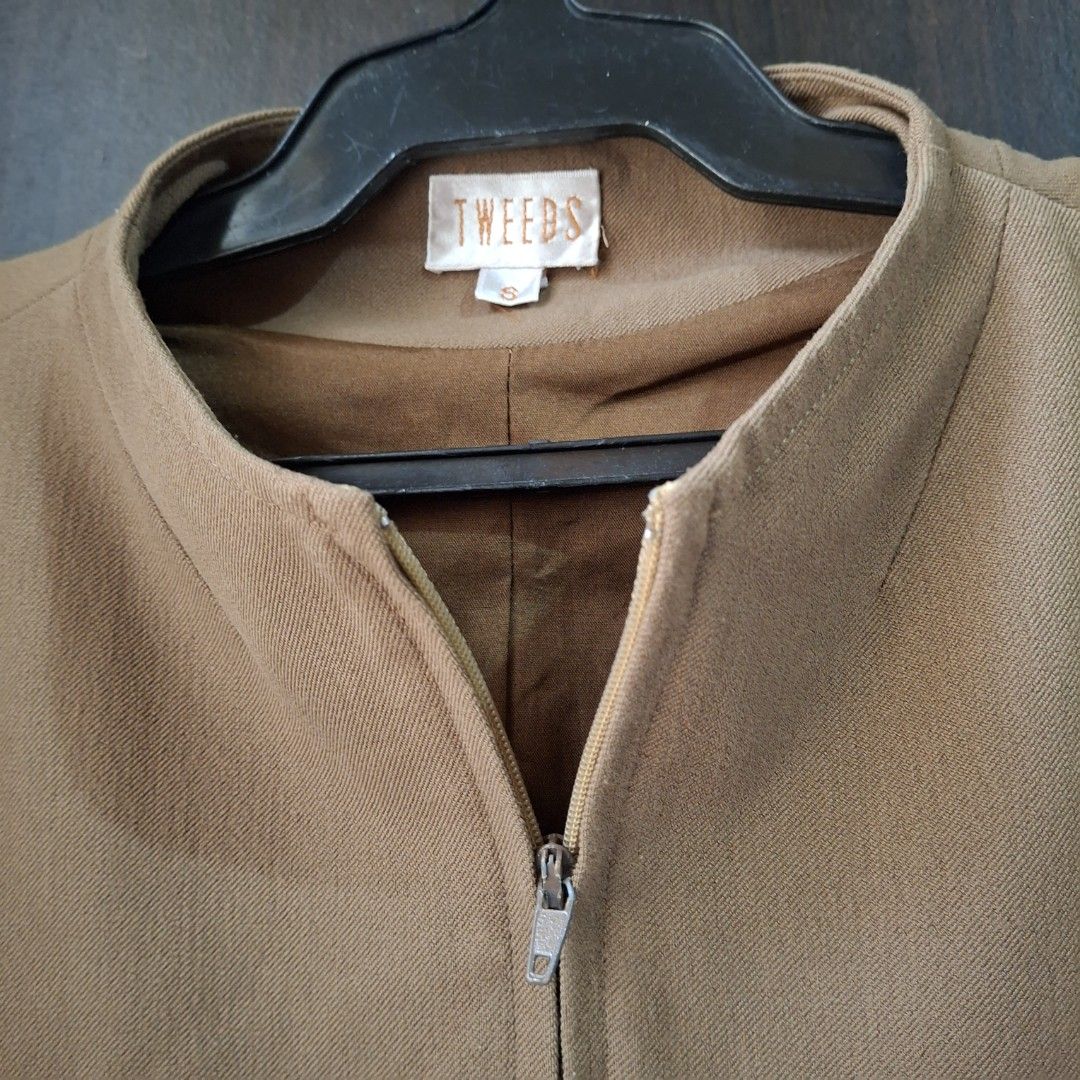 Zip-Up Collarless Jacket (Category: Coats, Jackets and Outerwear) located in Caloocan City. Submitted by mei56313 (Listing ID 1465392168, Image 3). Description: - preloved jacket - size S to M - color brown/tan/camel - good condition, working zippers, with signs of natural wear.