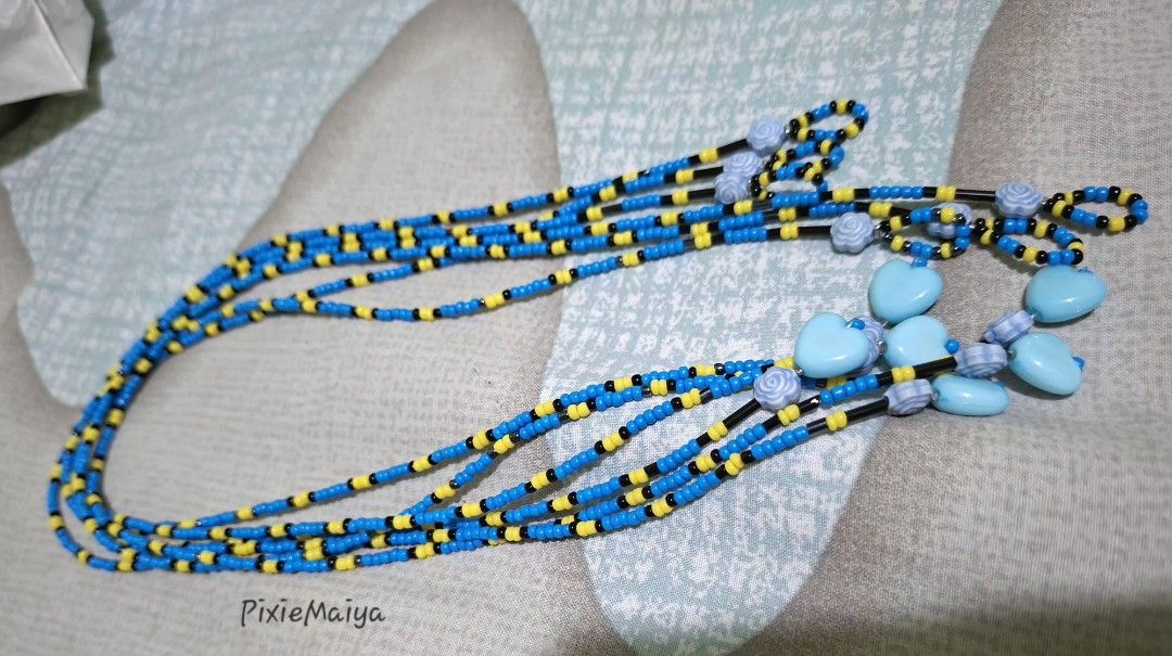 10 pcs Dory pattern Blue and yellow beaded necklace (Category: Necklaces) located in Valenzuela. Submitted by pixieworks64309 (Listing ID 1469382525, Image 2). Description: - Multistrand beaded necklace in blue, yellow, and black seed beads - Features cute light blue heart charms and carved floral beads - Long length design, slips right over the head easily - Handmade style with a vibrant color combination - Adds a great pop of color to everyday 