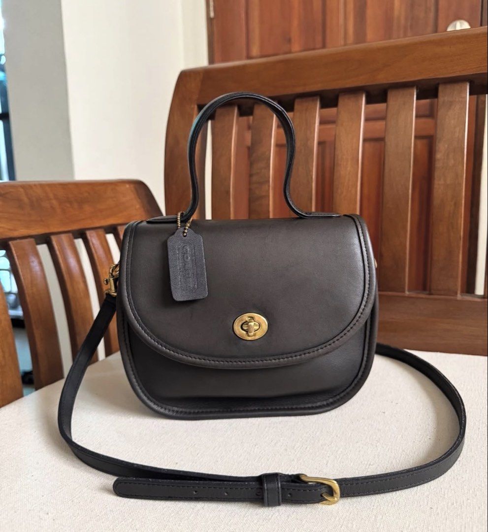1995 Coach Bellacourt (Category: Luxury Bags & Wallets) located in Pasig City. Submitted by toutestbeau (Listing ID 1469180536, Image 1). Description: Vintage 1995 Coach Bellacourt - In navy blue but almost black - good condition/ not abused - Made in the USA - No inclusion, just the bag and authenticity card How to purchase: - tap offer button upon agreement with the seller (dont offer unless decided) - Payment first before shipping - First to p