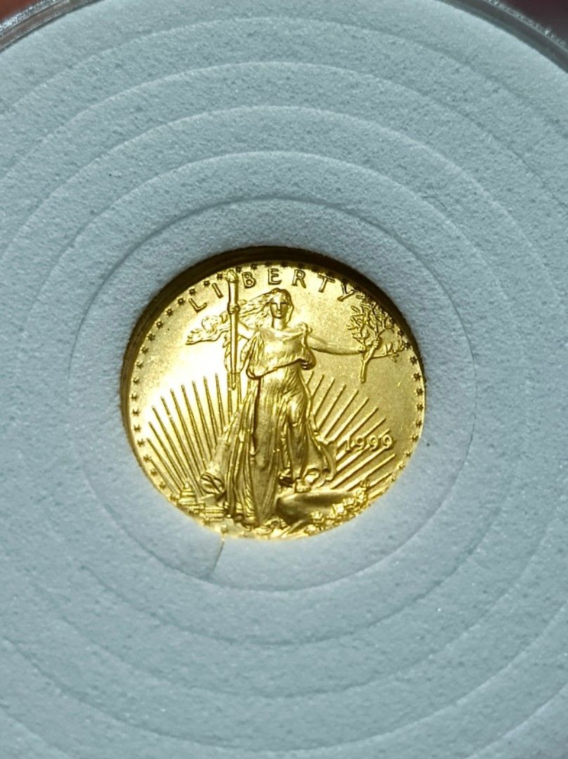 1999 1/10 oz US Gold Eagle 5 Dollars Coin (Category: Currency) located in Quezon City. Submitted by Coiners (Listing ID 1469352403, Image 1). Description: - Authentic 1999 US American Eagle gold coin ($5 face value) - Contains 1/10 oz of fine gold - Features iconic Lady Liberty on the obverse and eagle on the reverse - Stored securely in a protective round coin capsule with foam insert - Genuine US Mint bullion piece, ideal for stacking or collec