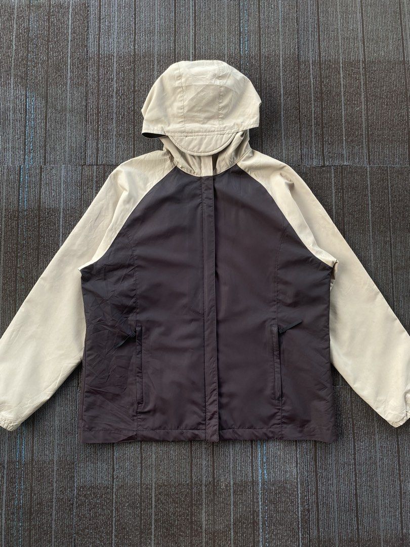 2000s Two Tone Nike Active Rain Jacket (Category: Coats, Jackets and Outerwear) located in Taguig. Submitted by offther4ck (Listing ID 1469165902, Image 1). Description: - Size M(8-10) - Issue: Minimal ( Provided in the pictures ) - Zippers are working smoothly - Complete tags - Width: 22 inches - Length: 28 inches.