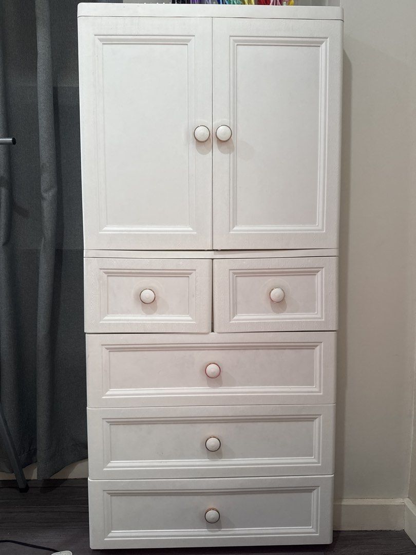 2 Door Cabinet with 5 Drawers (Category: Shelves, Cabinets & Racks) located in Manila. Submitted by nic_declutter (Listing ID 1469236476, Image 1). Description: White 2 Door Cabinet with 5 drawers 156x65x38cm Has bottom load-bearing pulley Has stainless steel clothes hanging rod Material: PP material without bisphenol A, heat-resistant, environmentally friendly and reassuring, Soft hardness is more suitable for shaping Ps: Caps displayed are not 