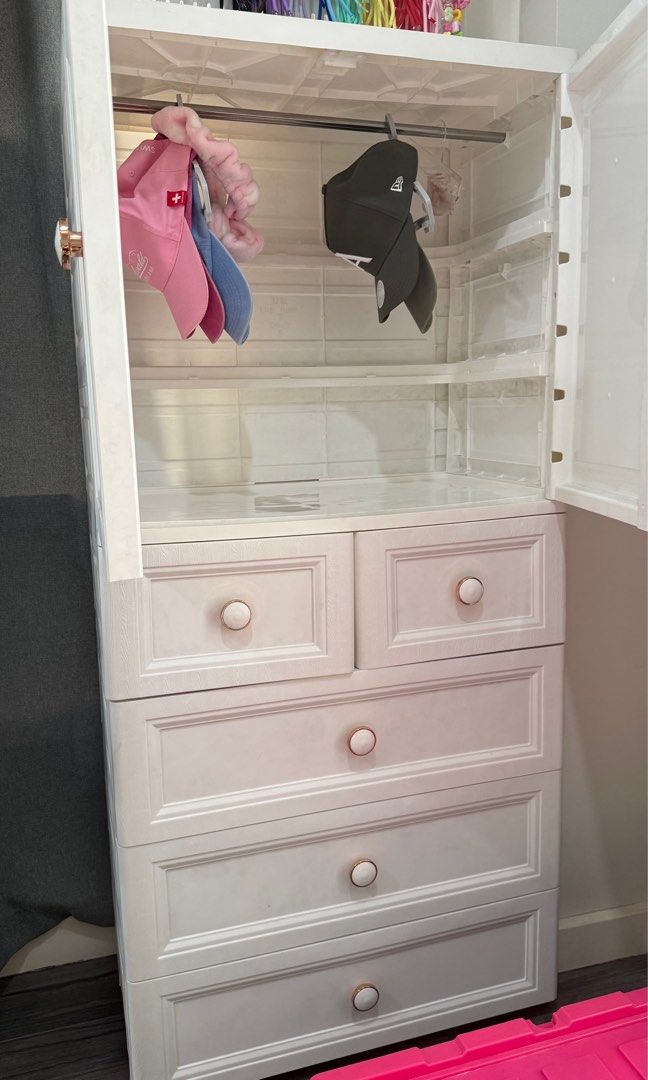 2 Door Cabinet with 5 Drawers (Category: Shelves, Cabinets & Racks) located in Manila. Submitted by nic_declutter (Listing ID 1469236476, Image 3). Description: White 2 Door Cabinet with 5 drawers 156x65x38cm Has bottom load-bearing pulley Has stainless steel clothes hanging rod Material: PP material without bisphenol A, heat-resistant, environmentally friendly and reassuring, Soft hardness is more suitable for shaping Ps: Caps displayed are not 