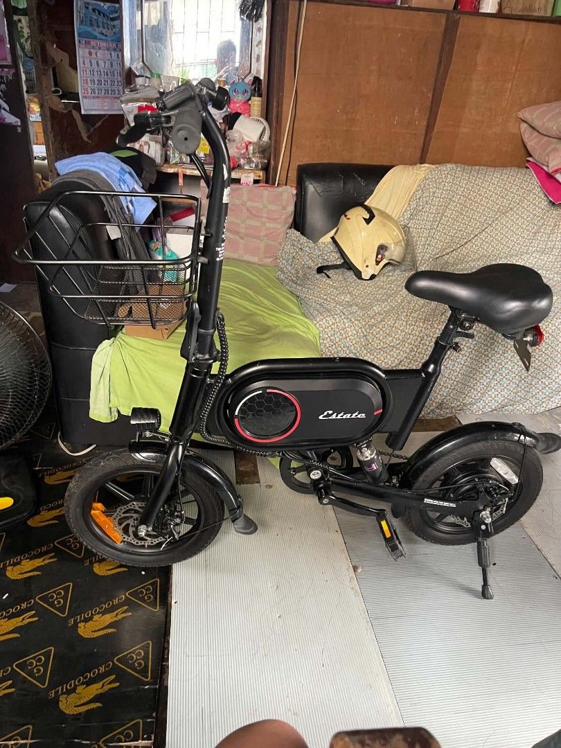 2wheels electric ebike (Category: Bicycles) located in Manila. Submitted by zenhawk_2d3bf2 (Listing ID 1469201096, Image 1). Description: - Color: Sleek black finish - Storage: Sturdy front metal basket for groceries or bags - Comfort: Padded saddle seat with adjustable height - Safety: Dual disc brakes for reliable stopping power - Convenience: Attached back kickstand and under-frame battery compartment - Usage: Ideal for daily commutes or casua