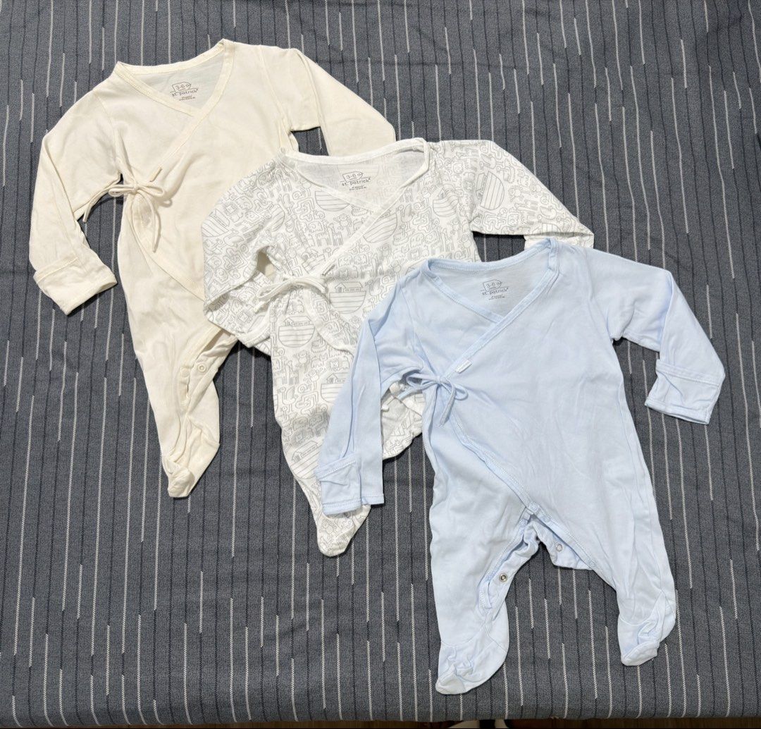3pcs St. Patrick Frogsuit Size 3-6m (Category: Babies & Kids Fashion) located in Caloocan City. Submitted by labellecollection (Listing ID 1469337662, Image 1). Description: - Brand: St. Patrick - Quantity: Bundle of 3 kimono-style rompers - Size: 3-6 Months - Colors/Designs: Cream (solid), White with grey animal print, Light blue (solid) - Features: Wrap-around design with side ties, bottom snap buttons, long sleeves, and built-in footies - Mate