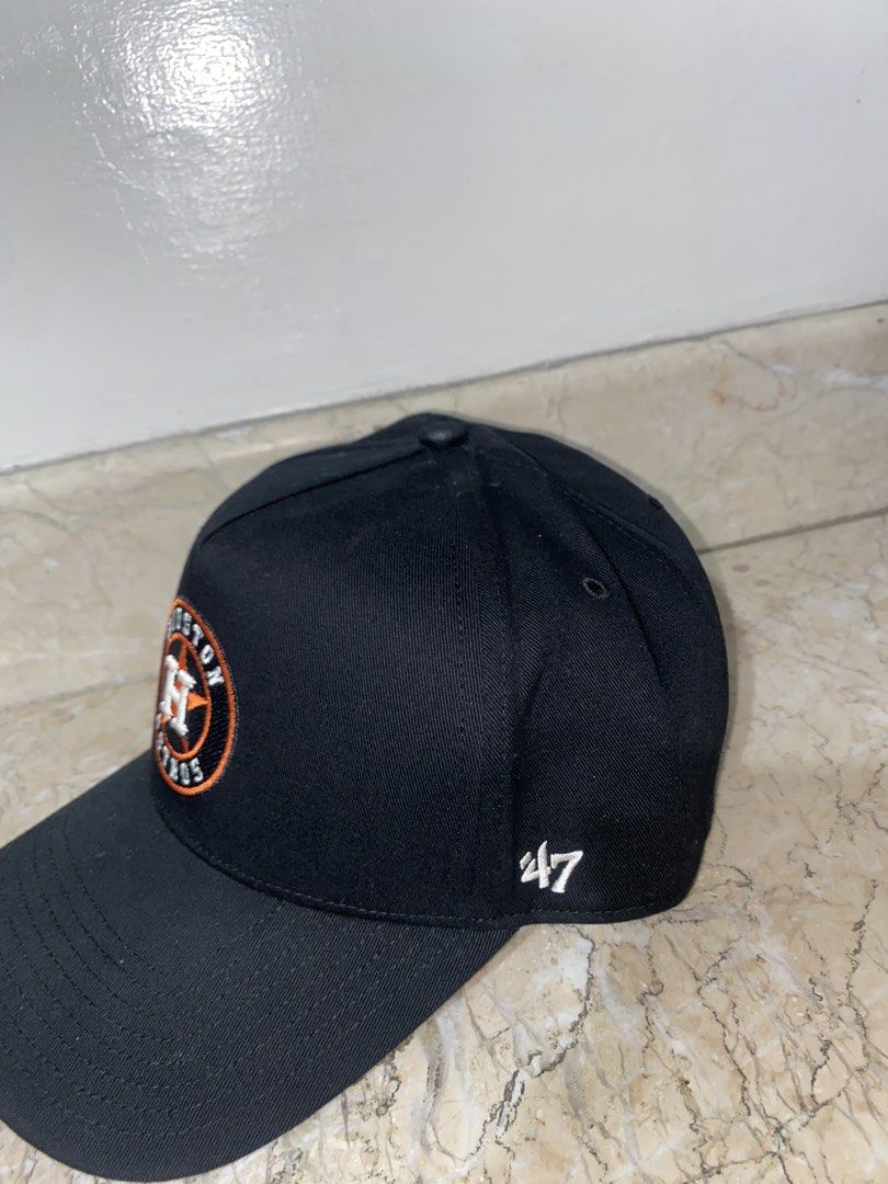 '47 Brand Houston Astros Black Cap (Category: Caps & Hats) located in Manila. Submitted by pems25 (Listing ID 1469285489, Image 2). Description: - Brand: '47 Brand - Team: Houston Astros - Color: Black with orange and white accents - Material: 100% cotton - Design: Structured crown, curved brim, embroidered front logo, side team lettering, and '47 logo on the left - Closure: Adjustable strap at the back.