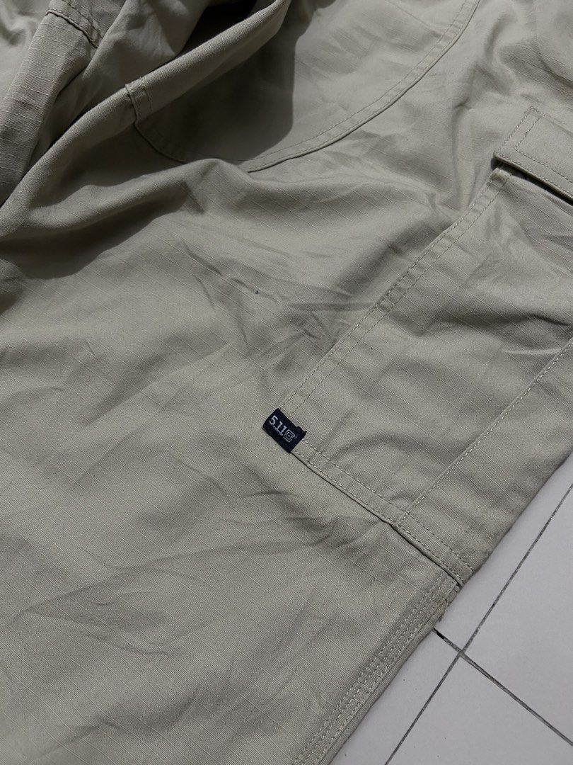 5.11 Tactical Cargo Pants Khaki (Category: Trousers) located in Quezon City. Submitted by commonwealthpickerph (Listing ID 1469282439, Image 3). Description: 5.11 Tactical Series Khaki cargo pants 35 waist 44.5 length 34 inseam 9 opening - in good condition - Has sign of used - 9/10 color rate - Issue: stain ( check pic to see details ) - Fit: Standard straight fit - Material: Durable ripstop fabric construction - Durability: Reinforced knees and
